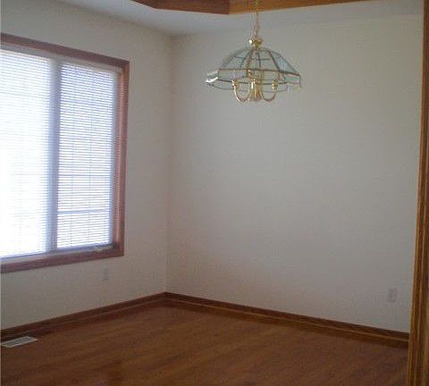 Formal dining with hardwood floor 