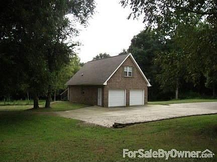 detached oversized garage has apartment/ office above
