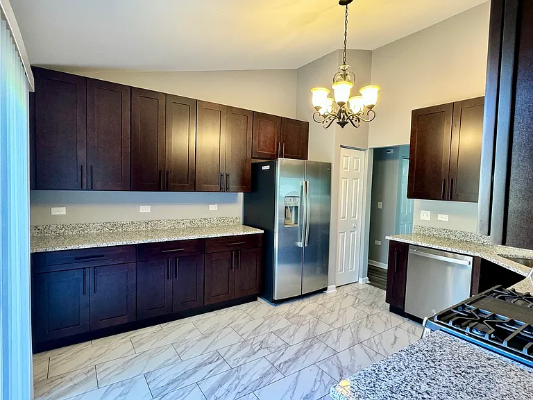 Kitchen with breakfast nook & pantry. Stainless steel appliances