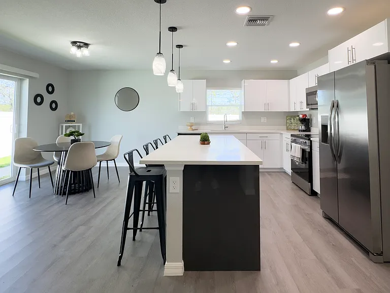 Island and dining space offer plenty of seating for everyone.