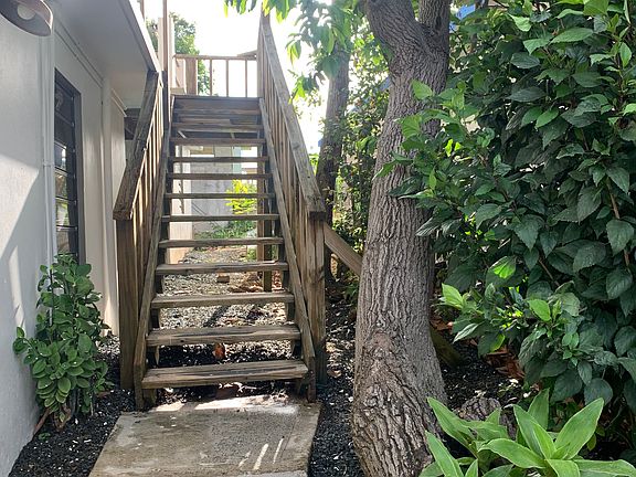 Pathway and stairs lead to private entrance.