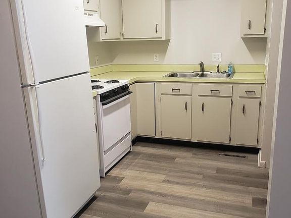 Kitchen. Washer and dryer hookups to the right in a large pantry area.