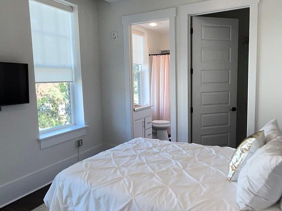 Enter a tranquil retreat with a well-designed bedroom. This space is crafted for comfort and relaxation, offering a cozy sanctuary for rest and rejuvenation.