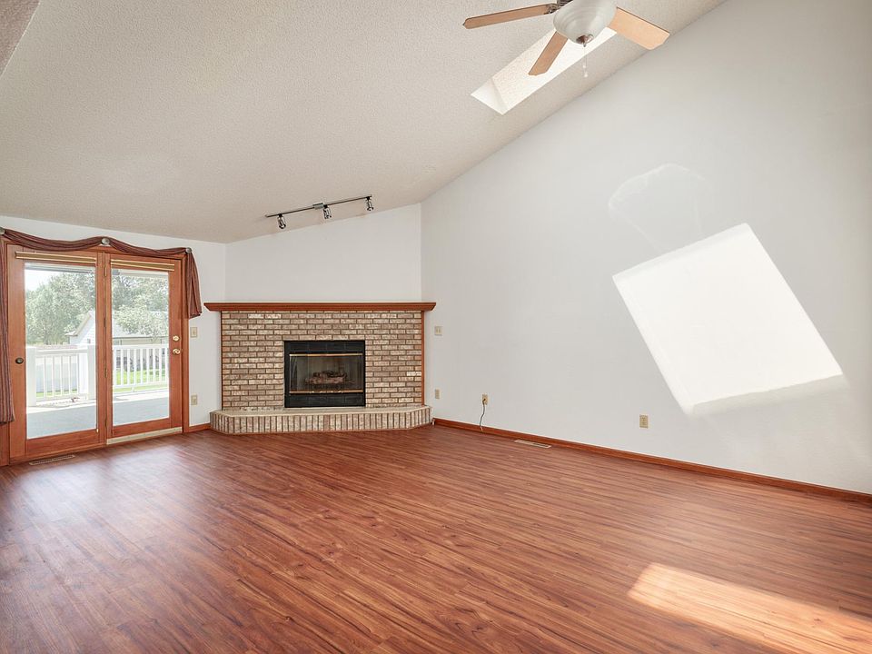 Living room with Gas Fireplace, skylights and vaulted ceilings!