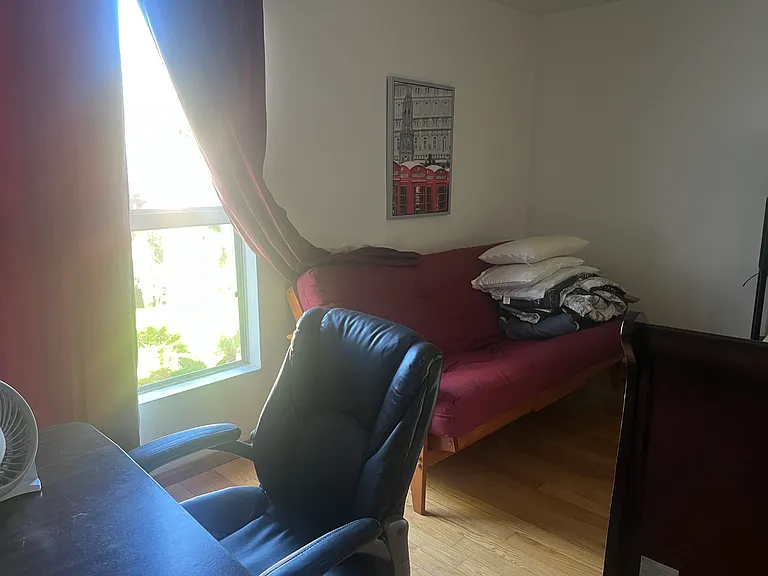 Leather chair, desk and sofa bed in the master bedroom