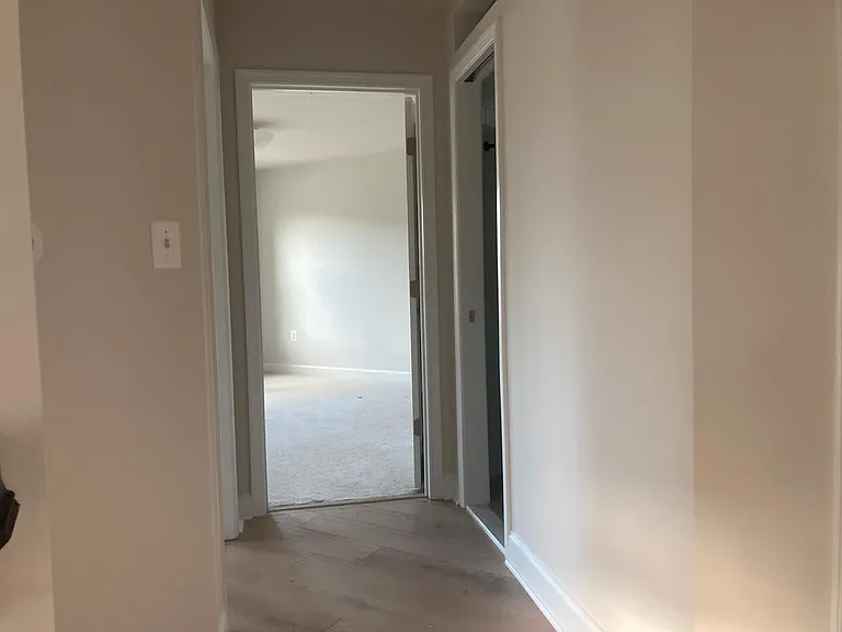 Hallway leading into bedrooms 2/3 & shared bathroom