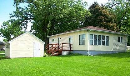 Back of home with large yard