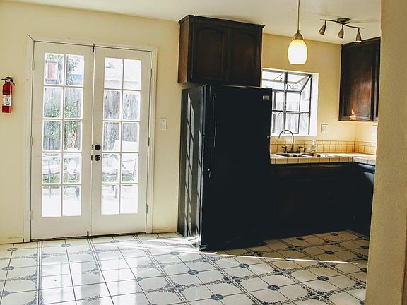 Kitchen french doors leading to backyard