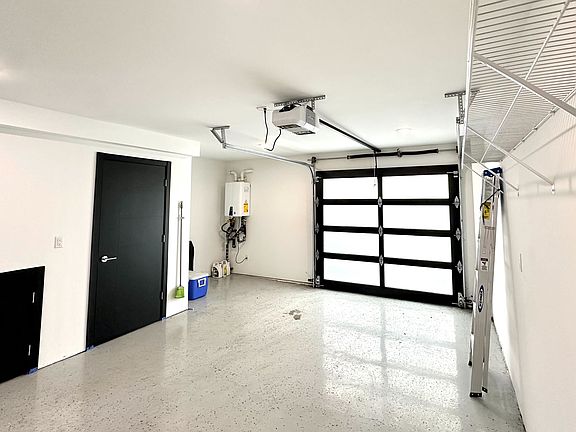 Attached one-car garage with electric opener, and LOTs of additional storage space. (Garage is spacious - easily fits my Jeep Wrangler.)