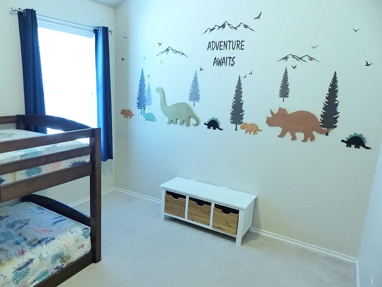 Secondary bedroom showing children's wall art
