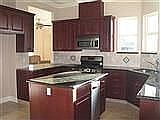 slab granite cherry cabinet kitchen
