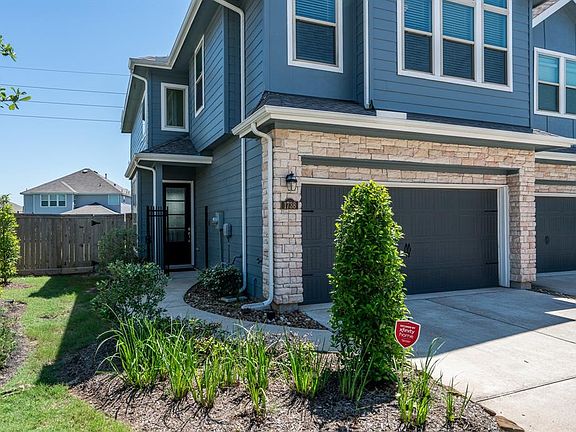 This Townhome offers great curb appeal with its stone elevation and landscaping.