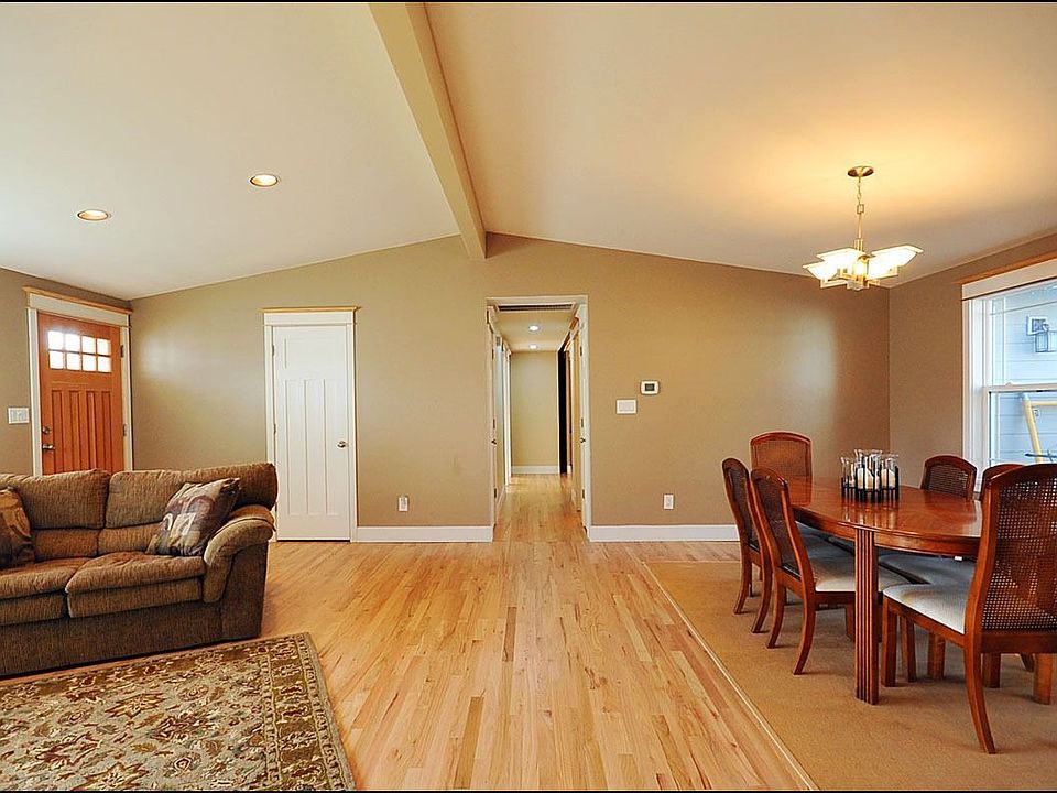 Living and dining rooms w/ vaulted ceiling