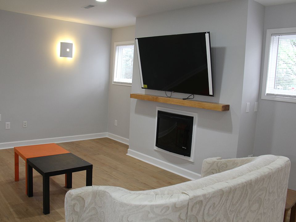 Living room with brand new 65"TV, fireplace.