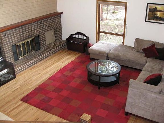 Wood burning fireplace, vaulted ceilings, hardwood floors