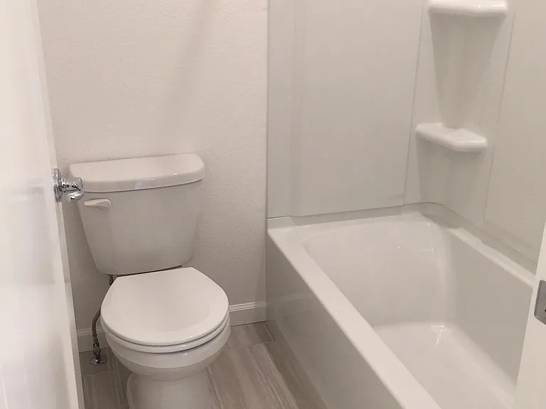 2nd story bathroom with shower over bathtub
