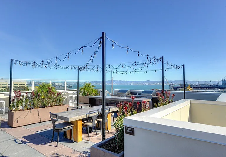 Rooftop grilling and outdoor dining area