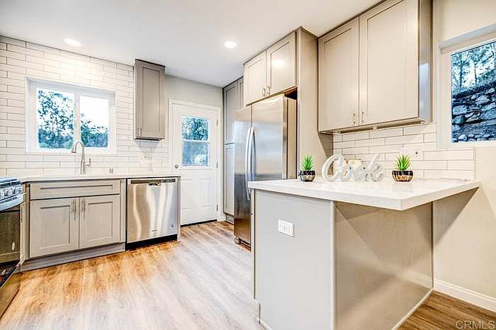 Stacked washer and dryer left of stove - not pictured