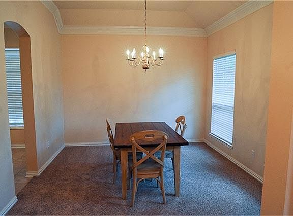 Spacious dining room with plenty of natural light.