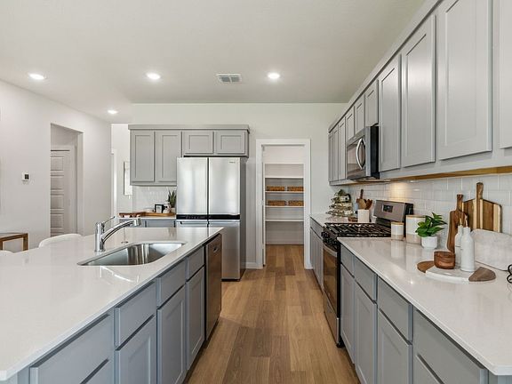 Kitchen in the Winters home plan by Trophy Signature Homes - REPRESENTATIVE PHOTO