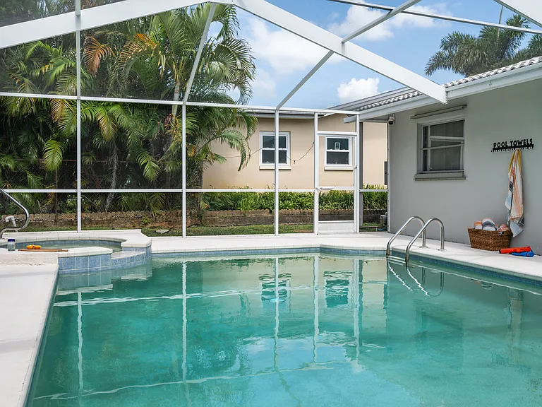 Fully screened-in swimming pool area.