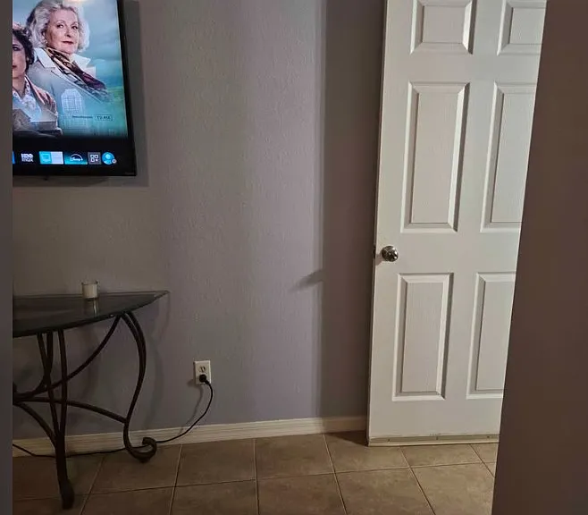 Entrance to Private Living Room Space with large TV and Coffee Pot