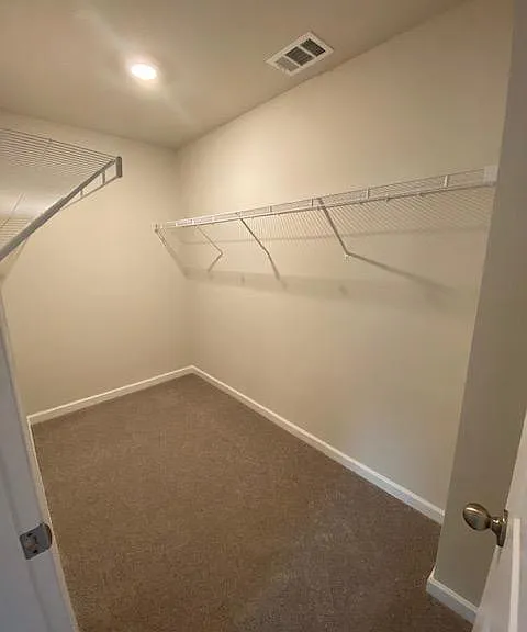 spacious walk in master closet