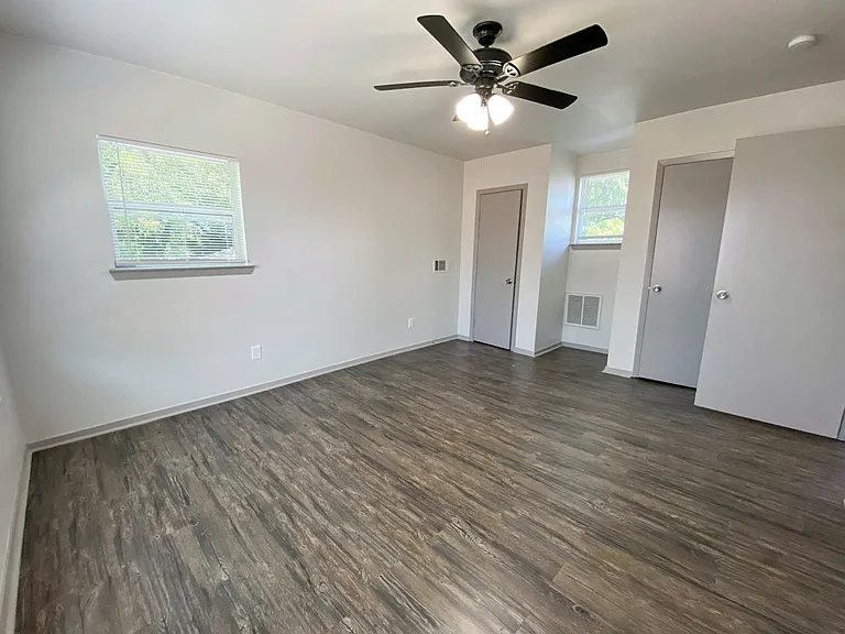 Upstairs bedroom with plenty of natural light and ample closet storage space for personal belongings