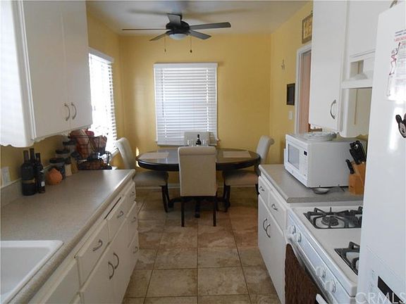 kitchen with tile flooring and dining room