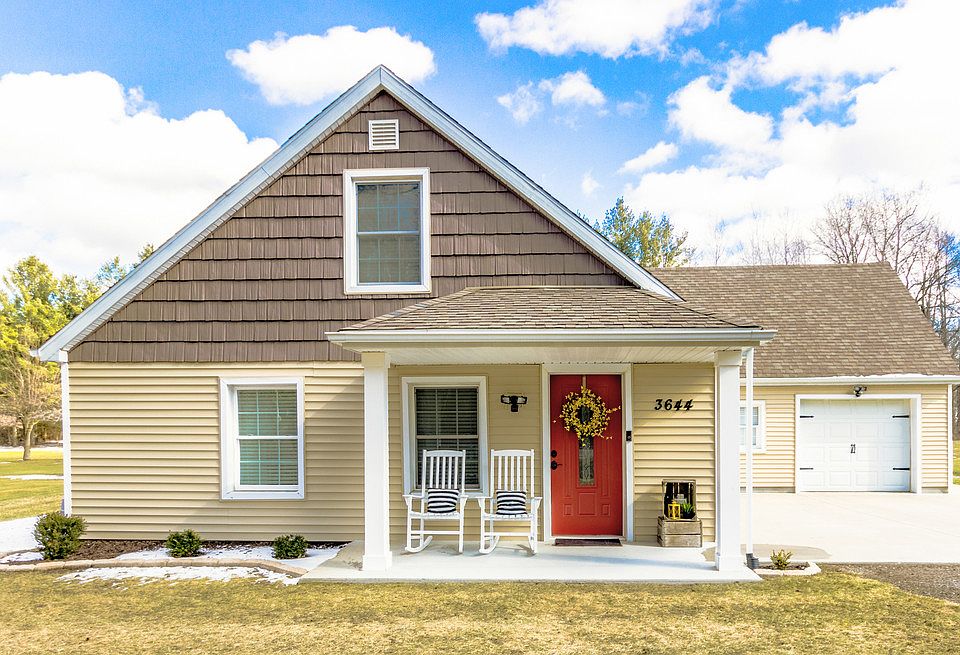 Absolutely adorable country home on the quiet end of N Jefferson. 14 X 7 ft front porch is big enough for two rocking chairs perfect for watching kids play on the drive way.  Large lot backs up to the woods.  This house has had all the work done, just move in and add your personal touches.  Following is a list of exterior improvements: front porch pillars, shed, landscaping, drain tiles, grass, exterior lights updated and added lighting, improvements to back patio, new paint on front doors, new door handles.  Set up your showing right away so you don't miss out on this home