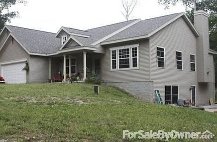 Front of house
						:
						This is front of home with a peak of the walk out basement and patio.