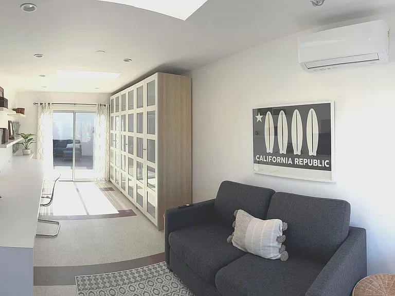 Built in desk, new queen sofa bed, closets in 500 sf bedroom/office space