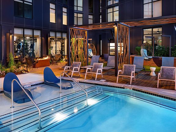 Sparkling Pool with Water Loungers and Cabanas