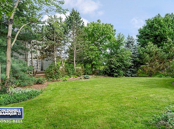 Extensive Mature Landscaping, including many various types of pine, maple, & birch trees, perennial