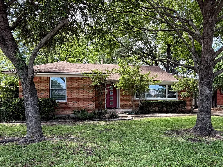 Brick exterior with a gabled shingle roof