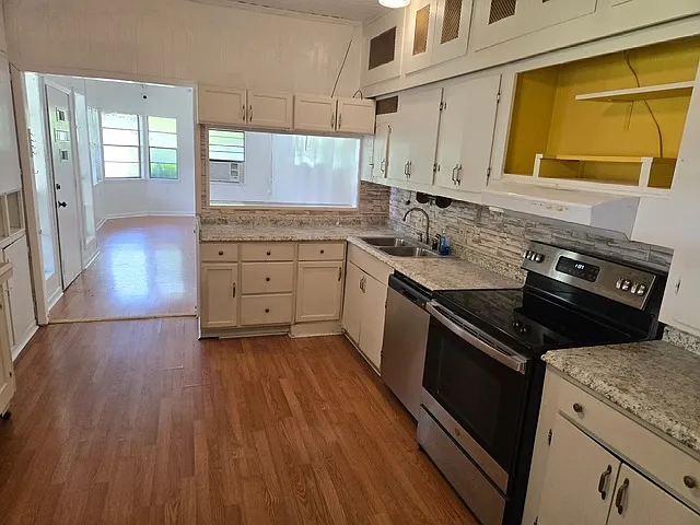 View of kitchen eat in area looking towards den