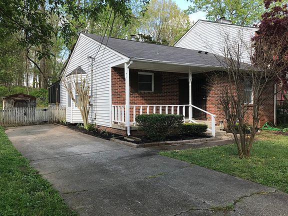 Parking for 4 cars and fenced in backyard with storage