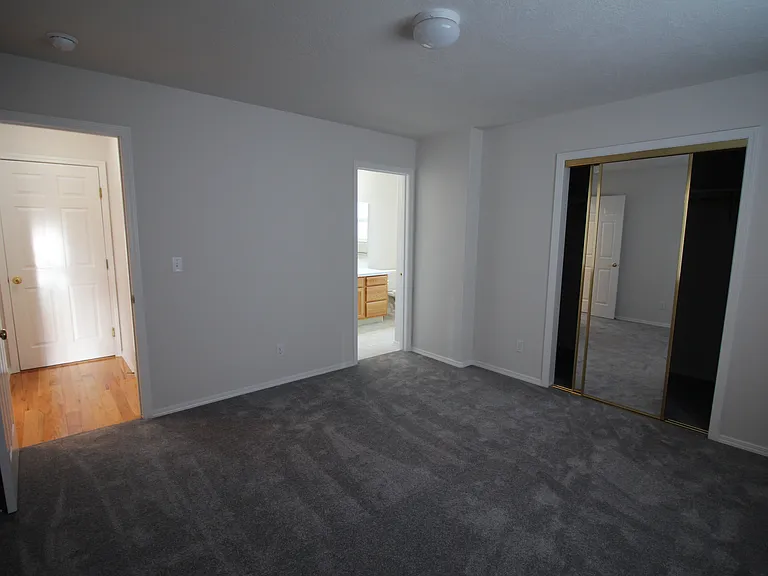 Primary bedroom with walk in closet and bathroom