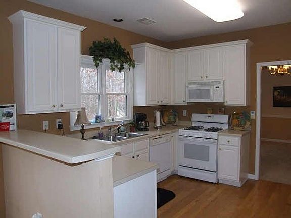 Lots of cabinets & desk. Opens to Family Room.