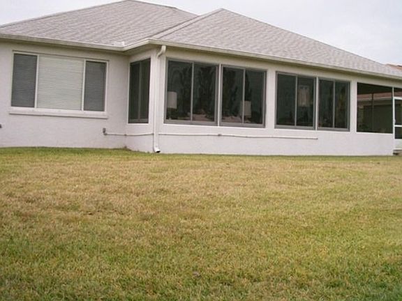 View of the homes back Florida Room overlooking the golf course