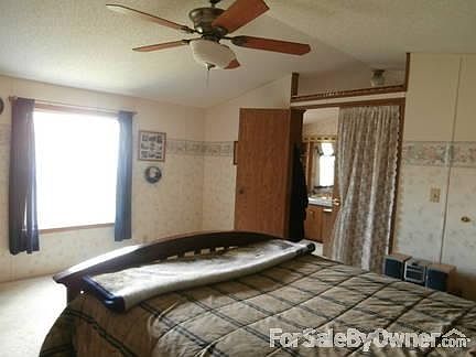 Master B/R has a large window and door way into Master Bath.