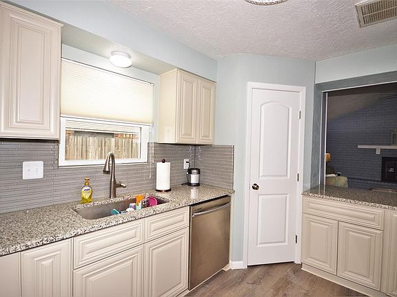 View of Kitchen overlooking the opening into the Den.