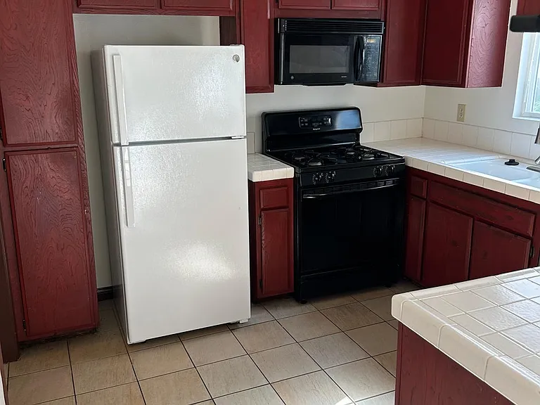 Kitchen, porcelain tile floors, recessed lighting, recently replaced faucet set and dishwasher