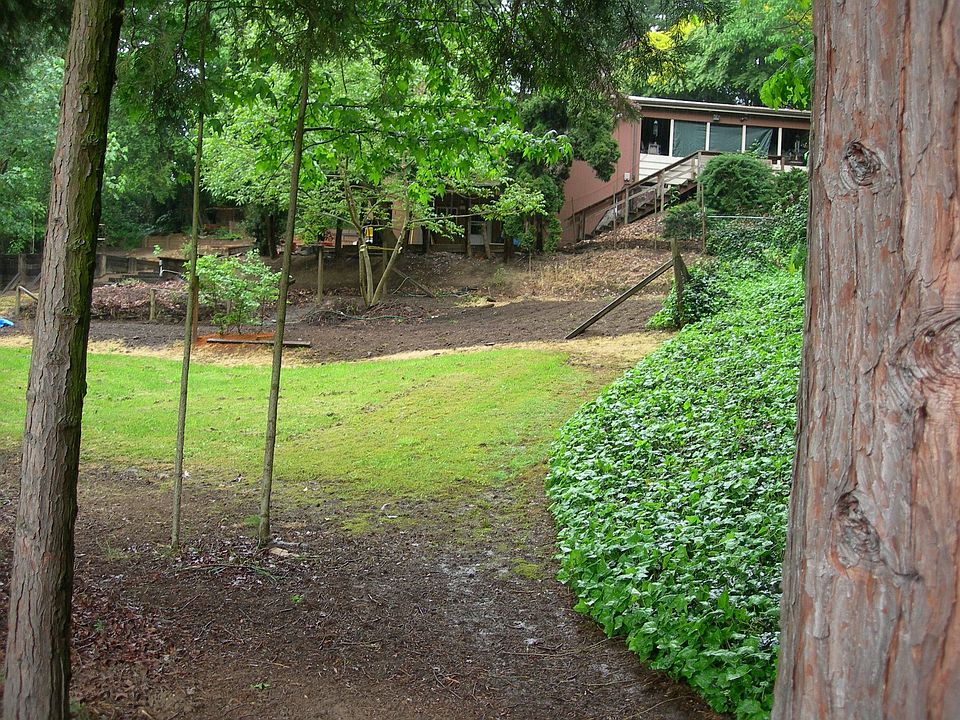 This is a view of the home from the lower  yard,area. 