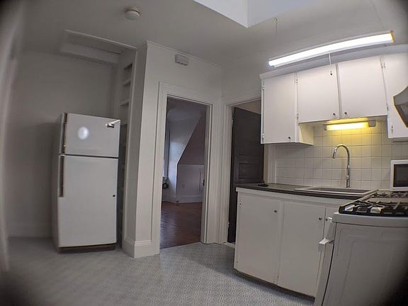 Kitchen view fresh paint, new ceramic floor, New light fixtures, fresh paint, new ceramic floor.
