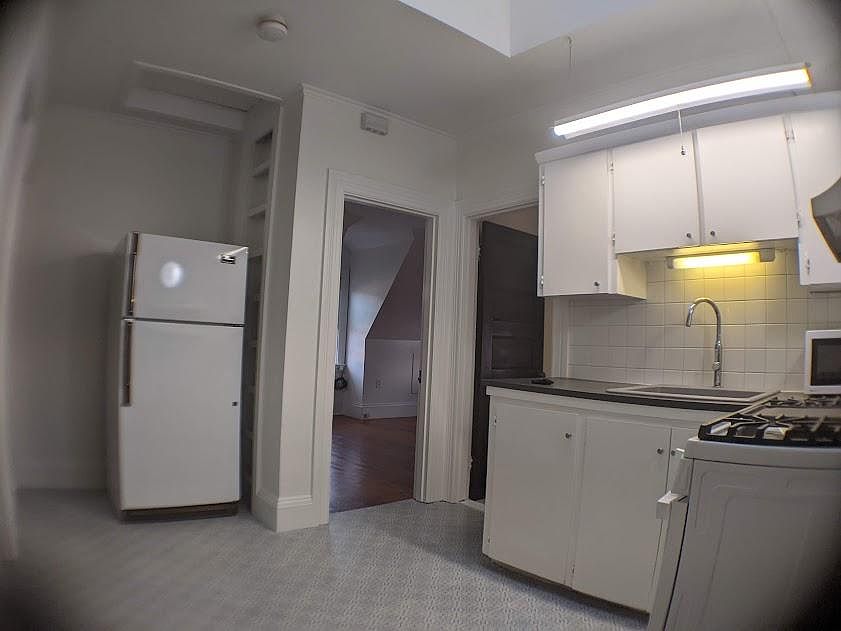 Kitchen view fresh paint, new ceramic floor, New light fixtures, fresh paint, new ceramic floor.
