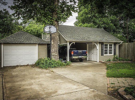 Detached 1 car garage, carport, and workshop