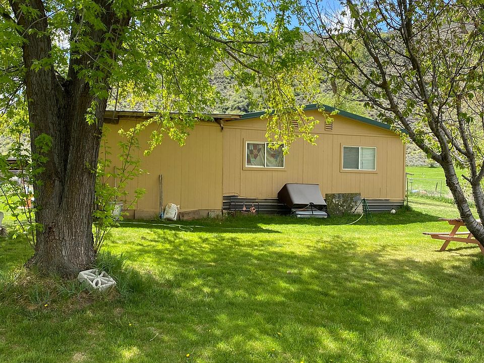 Side view of home. These trees are full of hummingbirds.