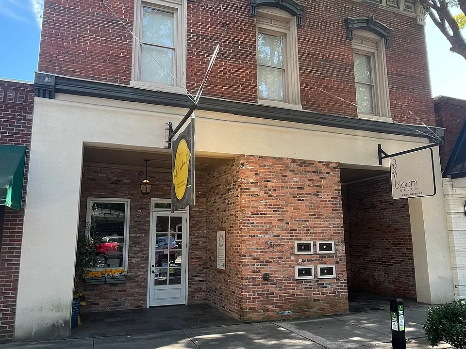 Front of building, right window is the apartment window in living room:.