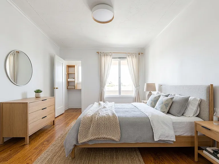 2 of 4 bedrooms with two closets and window to 2nd floor deck (styled with ai)